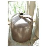 Stoneware brown whiskey jug