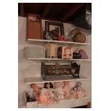Contents of shelves-baby dolls, gourd