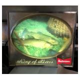 Lighted Budweiser beer sign