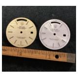 2 watch faces marked Rolex