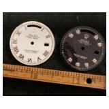2 watch faces marked Rolex