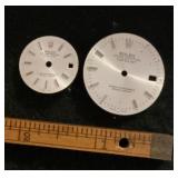 2 watch faces marked Rolex