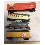 4 small gauge train cars