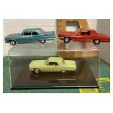 3 promo cars, 1 display case