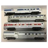 4 small gauge passenger train cars