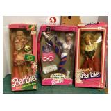 3 boxed Barbie dolls
