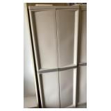 Plastic 2-door garage cabinet and contents Plastic 2-door garage cabinet and contents