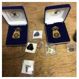 Group of shooting medals and pins