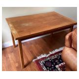 Wood table with self-stored leaves