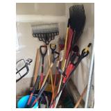 Long handle yard tools in garage