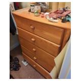 Natural wood Stanley chest of drawers in closet