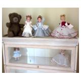5 dolls and plush bear
