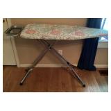 Ironing board with iron rest