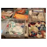 5 tubs of quilt fabric, quilt squares and patterns