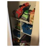 Contents of closet with toys and games