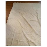 Machine quilt with scalloped edges