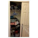 Contents of bedroom closet with purses & storage