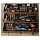 Tool box packed with leatherwork tools