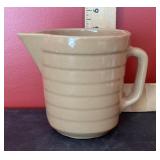 Stoneware pottery advertising cream jug