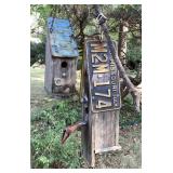 2 handmade birdhouses in back yard