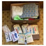 Box of sewing fabric and patterns