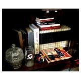 Contents of shelf with encyclopedias and books