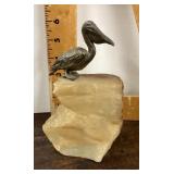 1974 Pelican figure on stone