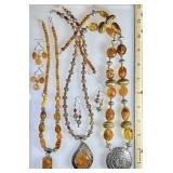 3 amber necklaces and earrings