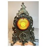 Antique brass clock case repurposed as a light