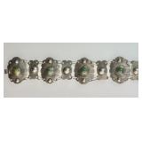 Chunky silver bracelet with green stones