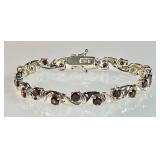 Sterling and garnet tennis bracelet