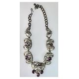 Ornate silvertone necklace with purple stones