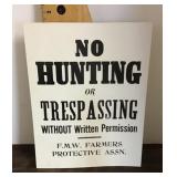 No hunting or trespassing cardboard sign