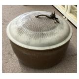 Copper pot garden hose storage