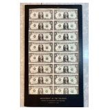 16 uncut US Treasury $1 bills in cardboard frame
