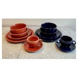 Two 6-piece Fiesta place settings -rust/navy blue