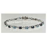 Sterling tennis bracelet with 2-tone blue stones