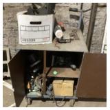 Small locking cabinet on casters with contents