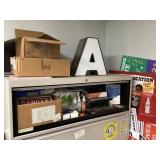 Contents on and around file cabinet --as pictured