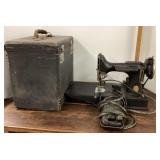 Antique Singer portable sewing machine with case