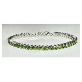 Sterling silver tennis bracelet with green stones