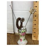 Antique hat pins in porcelain holder