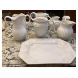 Collection of new ironstone pitchers & platter