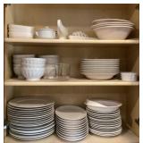 Large lot of dishes in upper cabinets