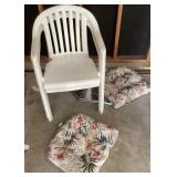 Pair of plastic stackingpatio chairs with cushions