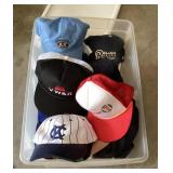 Tote with lid full of snapback ball caps