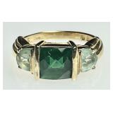 Gold over sterling ring with faceted green stones