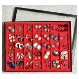 Pierced earrings in divided glass top riker box