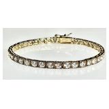 Gold over sterling tennis bracelet w/clear stones