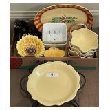 Flat of colorful ceramic serving pieces